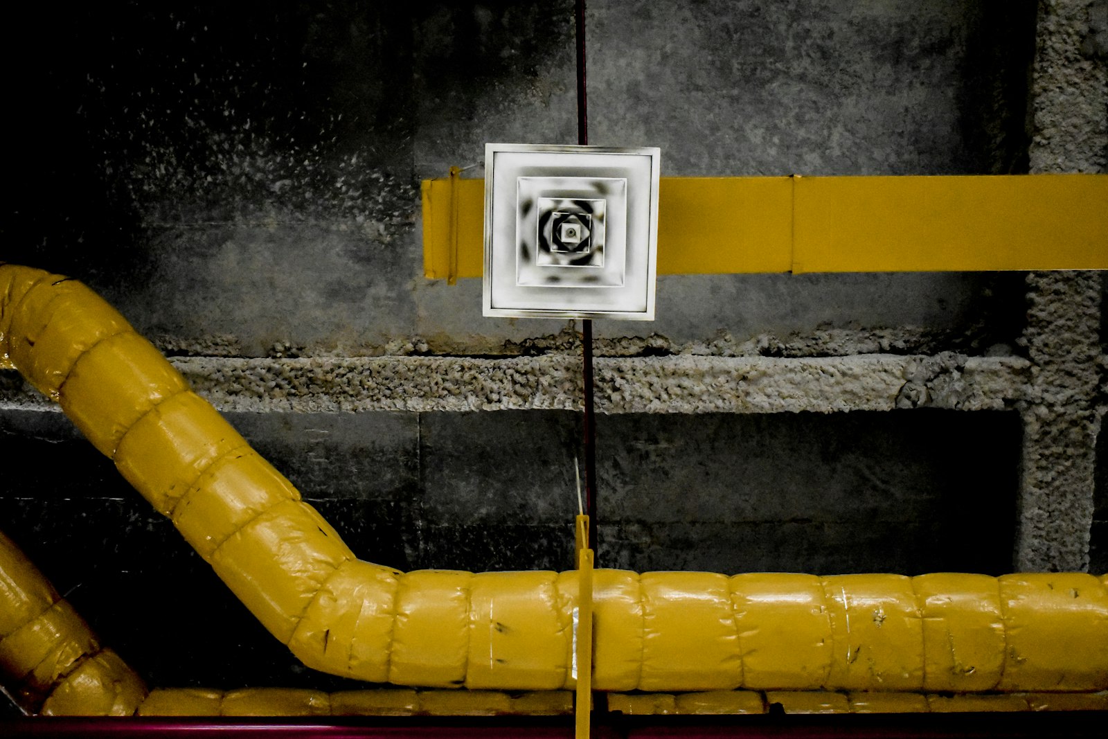 Square supply air vent set into a wrapped duct run